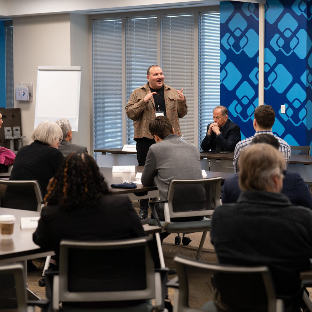 Alfonso Wenker speaking with housing leaders in Atlanta
