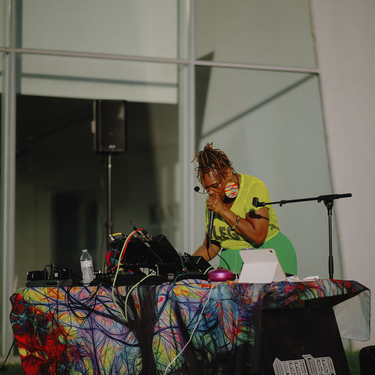 Queen Drea mixing sounds and performing live outside
