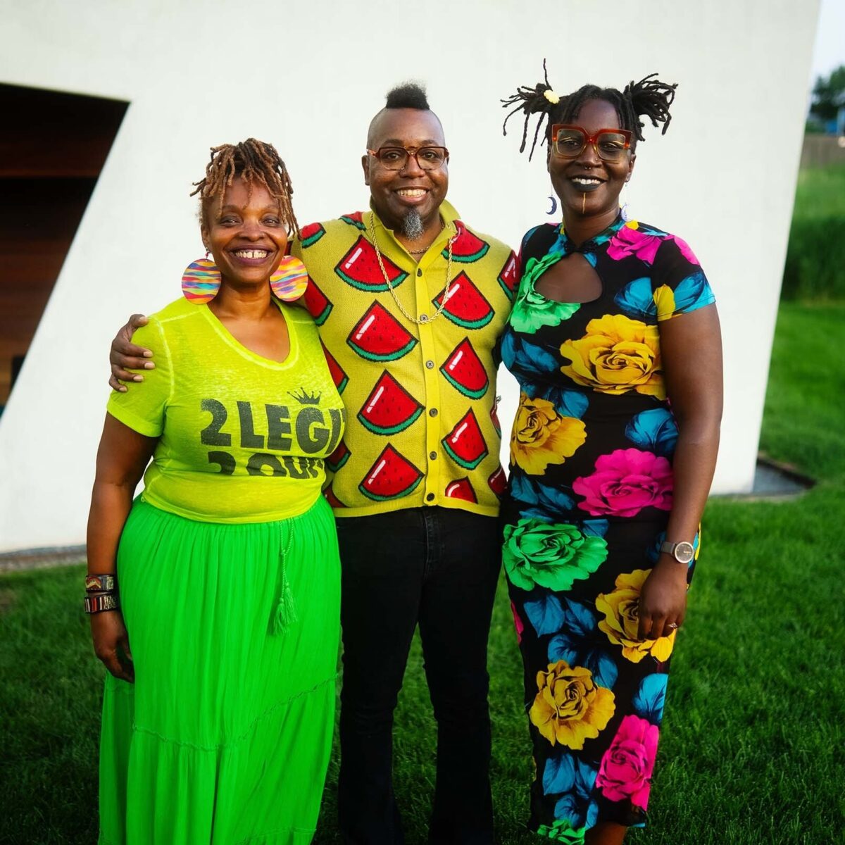 Queen Drea standing alongside her fellow performers