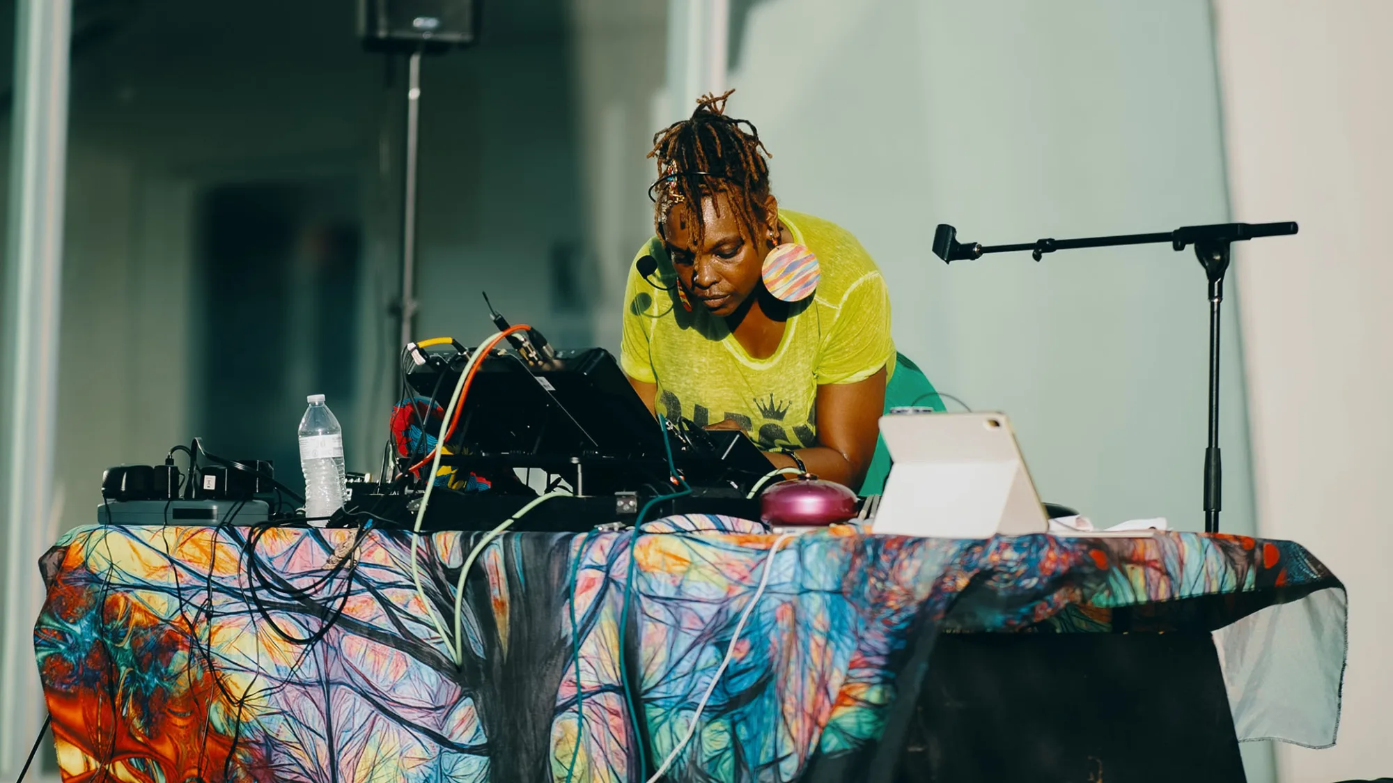 Queen Drea mixing sounds at an outdoor venue