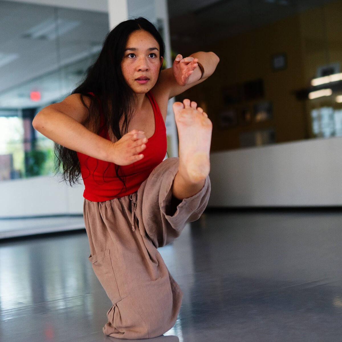 Kealoha posing in a dance studio