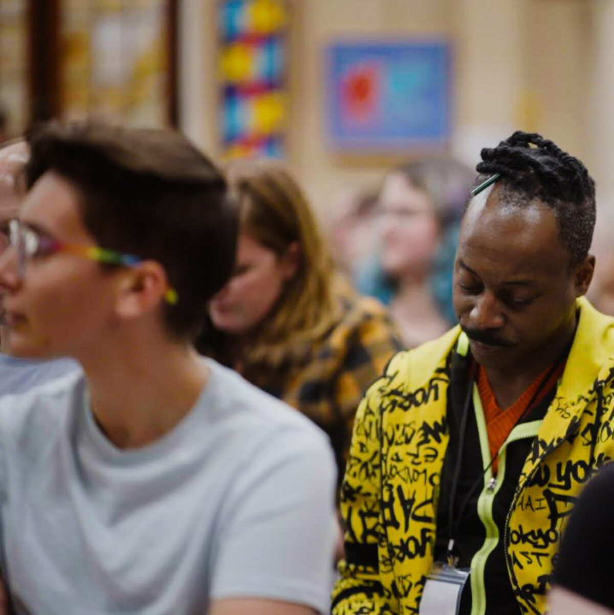 Choir members seated during rehearsal