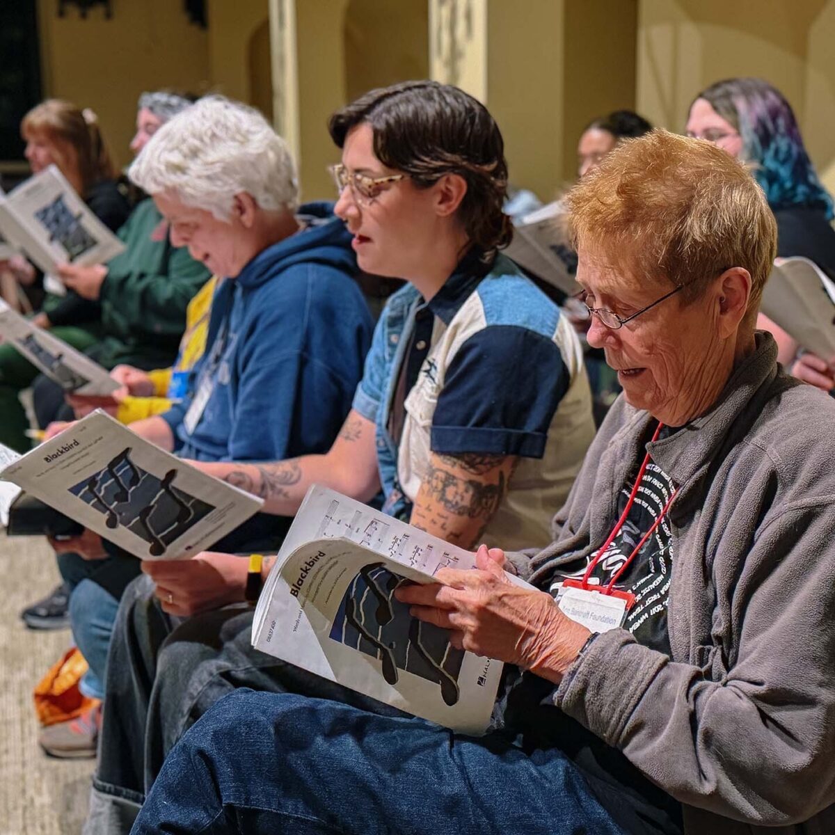 Members of the choir singing at a rehearsal