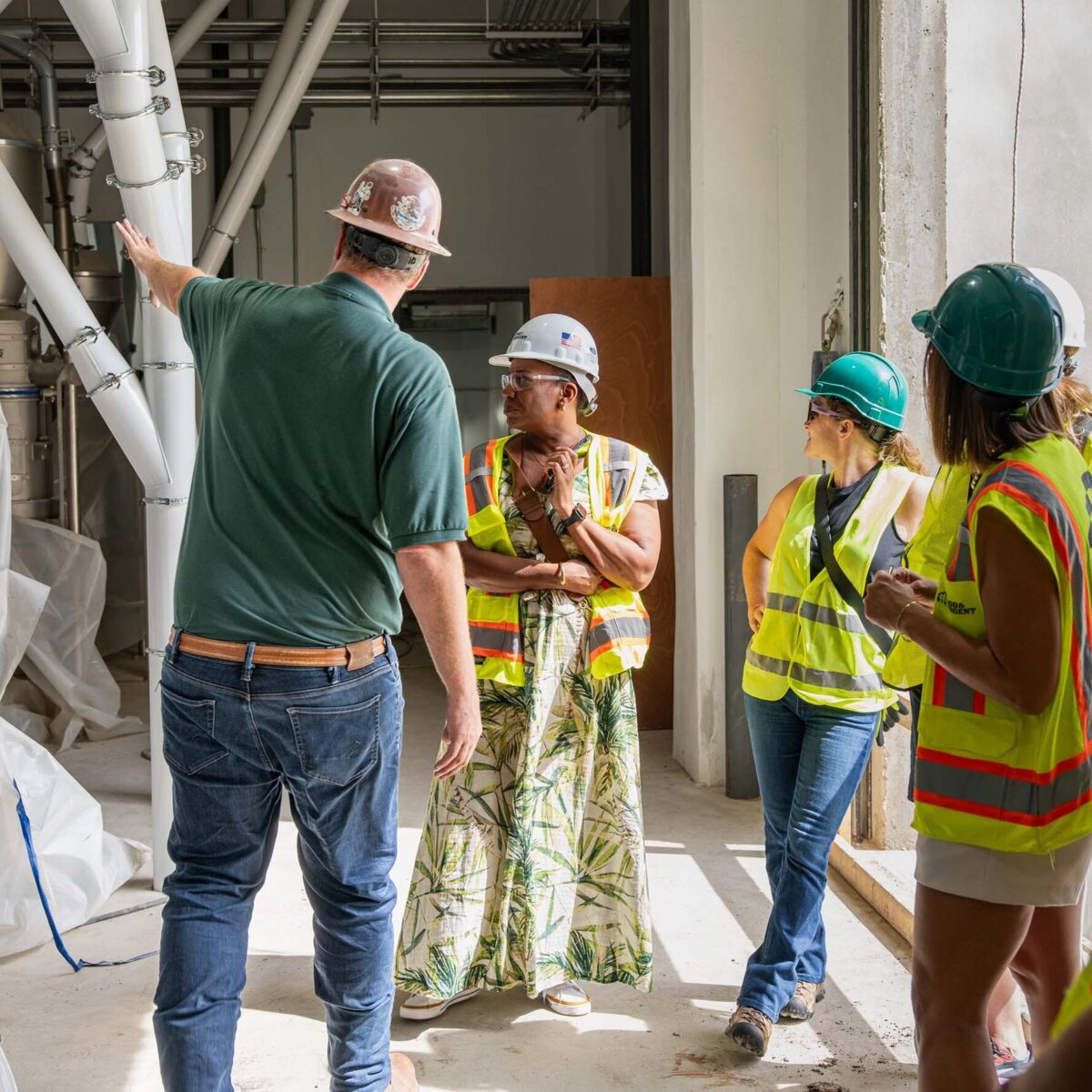 Chanda with staff touring Green Acres Milling
