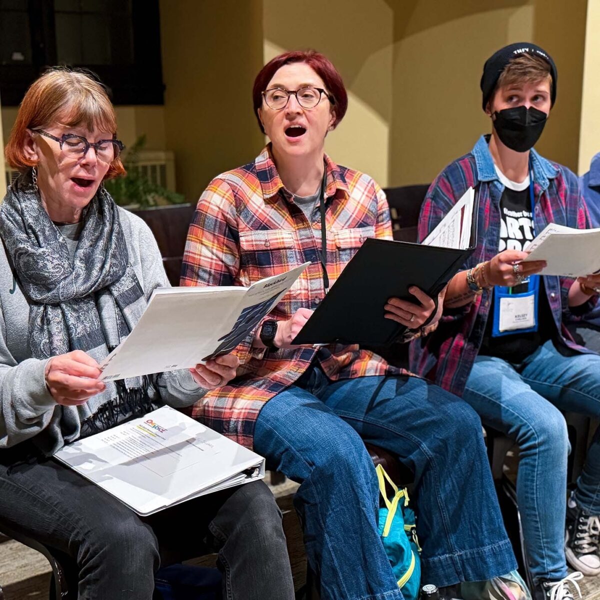Members of the choir singing during rehearsal