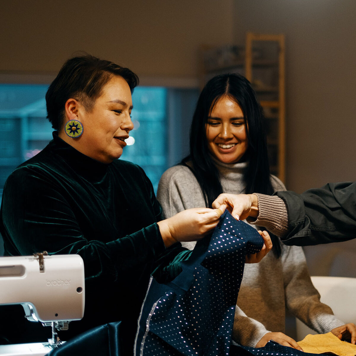 Raine holding some fabric
