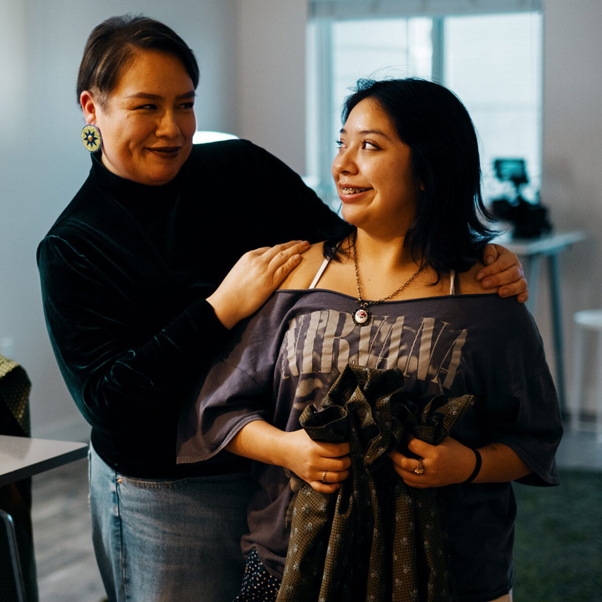 Raine standing with her daughter