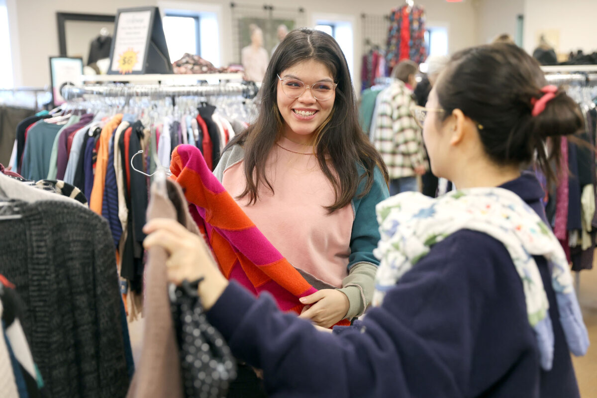Two women shopping for clothes at Valley Outreach