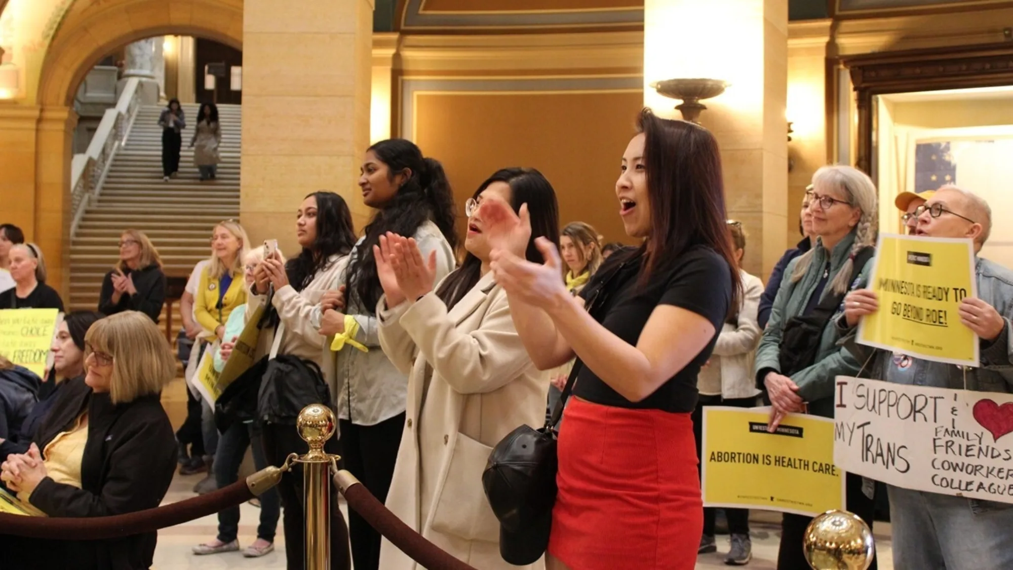 People applauding at the state capitol