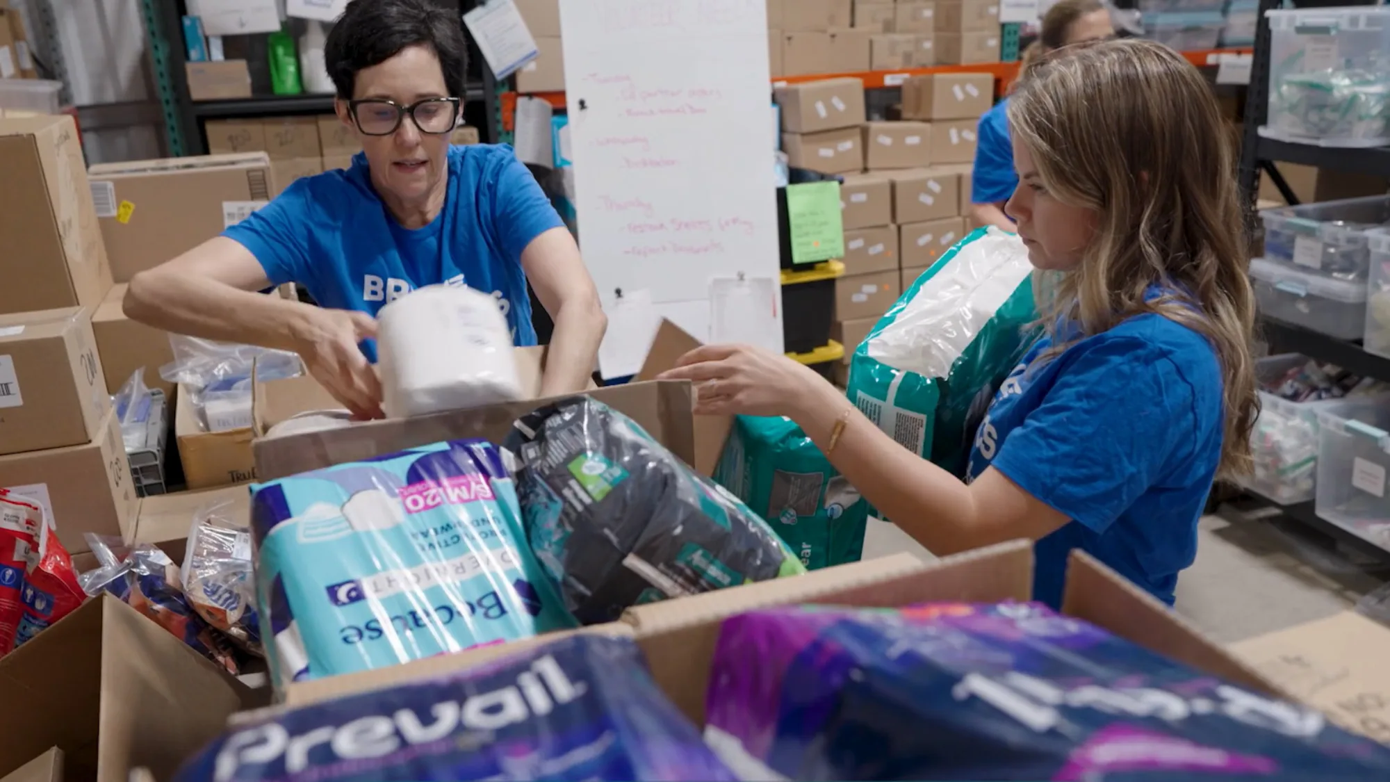 Volunteers packing hygiene kits at Bridge to Basics