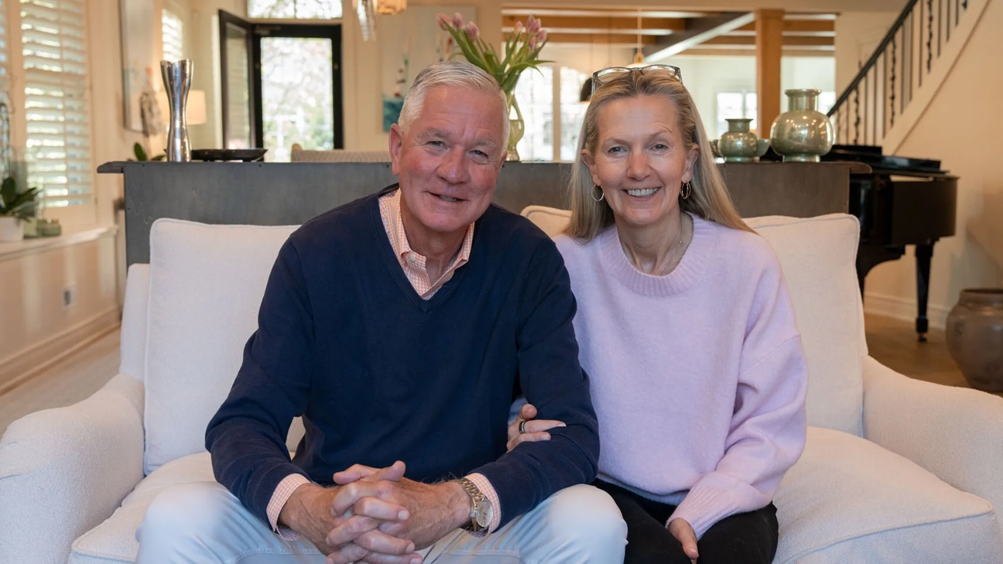 Jeff and Janet sitting together in their living room