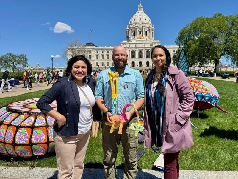 Artists standing outside the MN state capitol