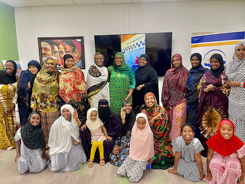 Hooyo Hour Organization group of smiling adults and children