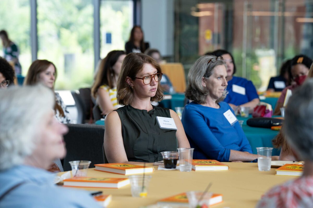 View of audience listening to program