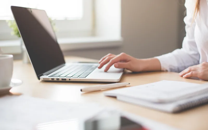 Donor Resources showing a woman using a laptop